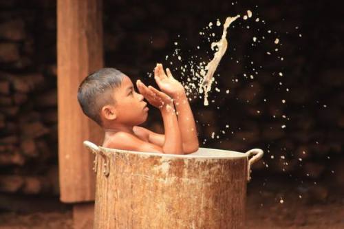 BOY PLAYING WITH WATER